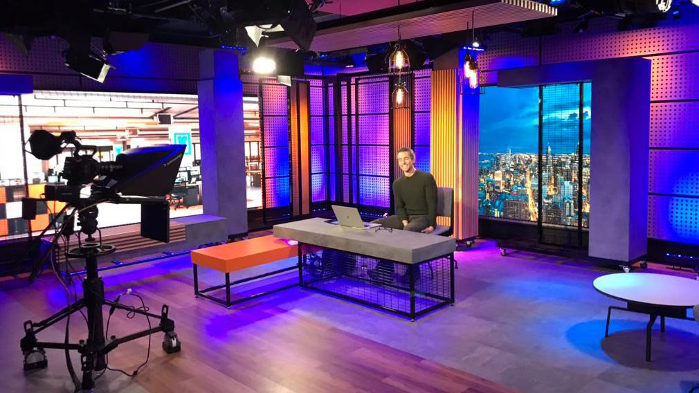 Behind-the-scenes photo of a man smiling on set for Newsy Chicago in 2018