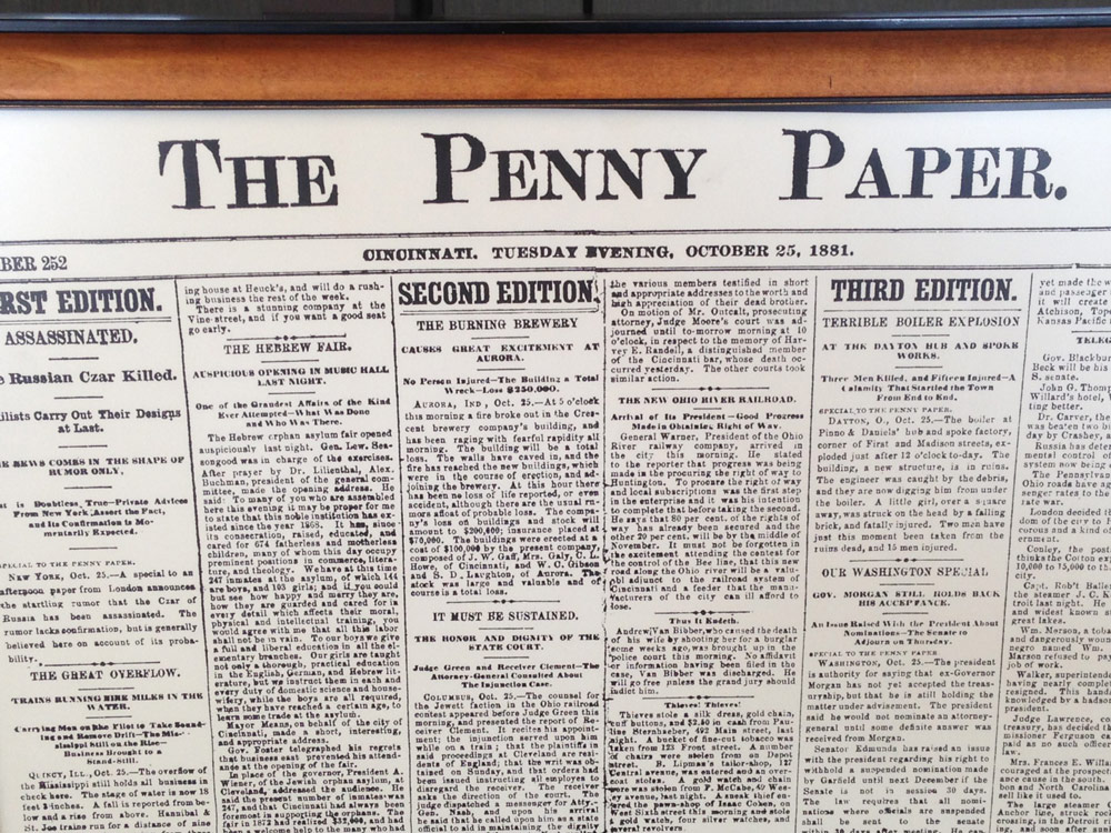 Photo of a framed copy of the Penny Paper Newspaper page for Cincinnati