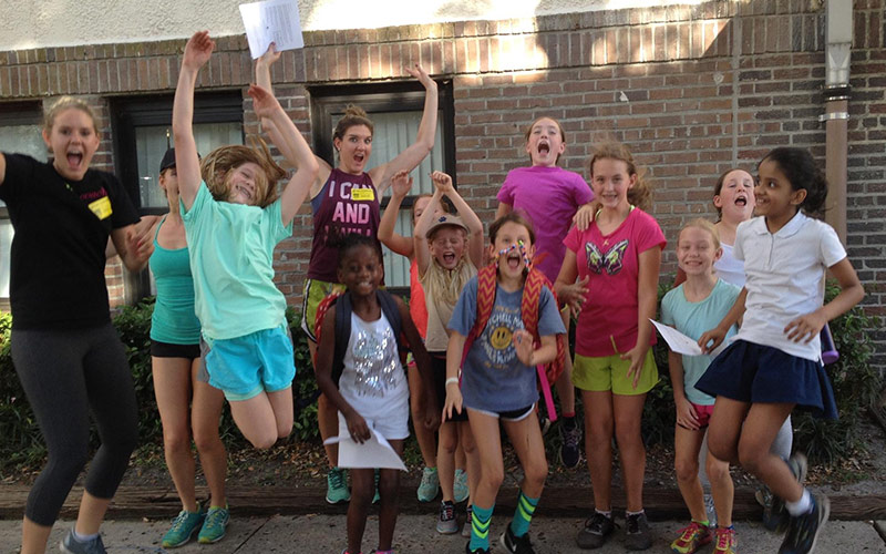 children excitedly jumping