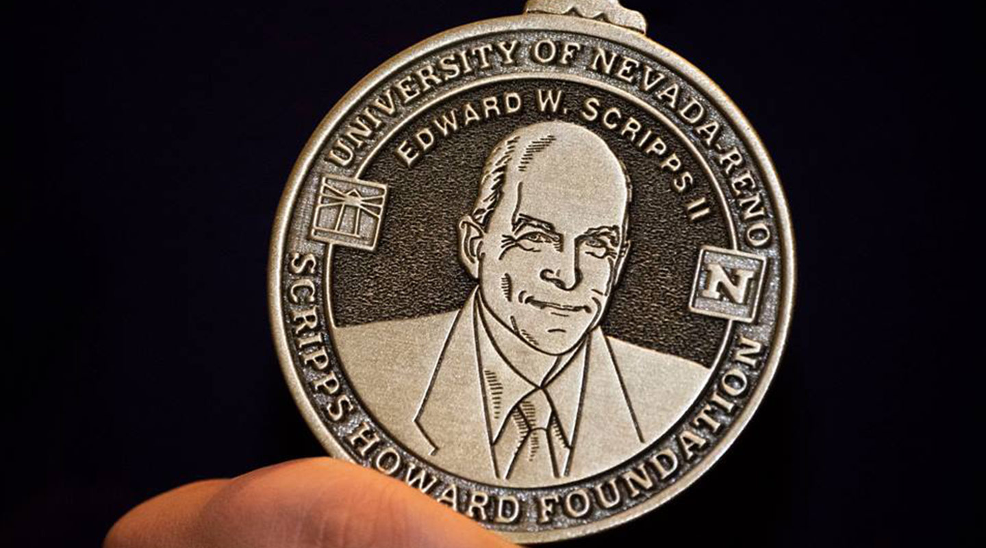 Photo of a coin memorializing the Scripps Howard Foundation university partnerships