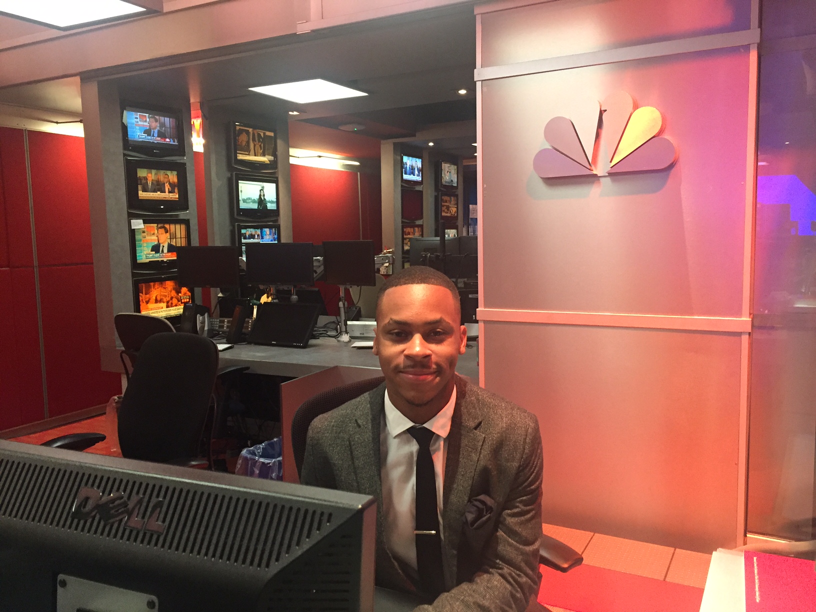 Photo of Mr. Desmond Smalley as he sits behind a Dell computer at the MSNBC office for his internship