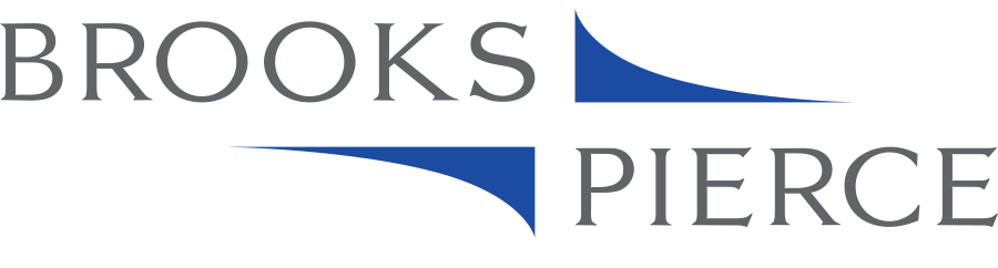 Brooks Pierce logo - the letters Turner in grey with blue ramp symbols