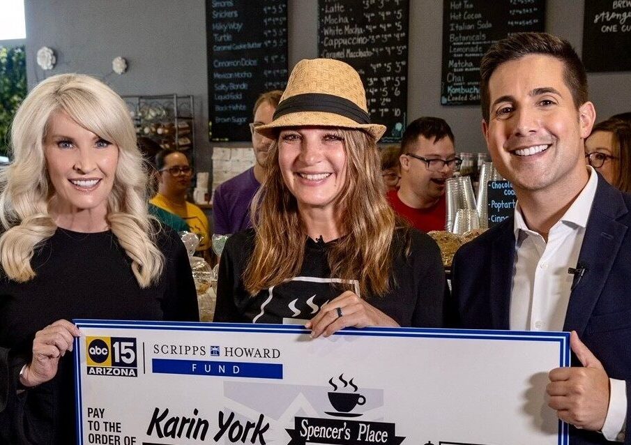 Anita Helt, ABC15 vice president and general manager; Karin York, award recipient; Nick Ciletti, ABC15 anchor - pictured at Spencer's Place coffee holding a large check for $10,000