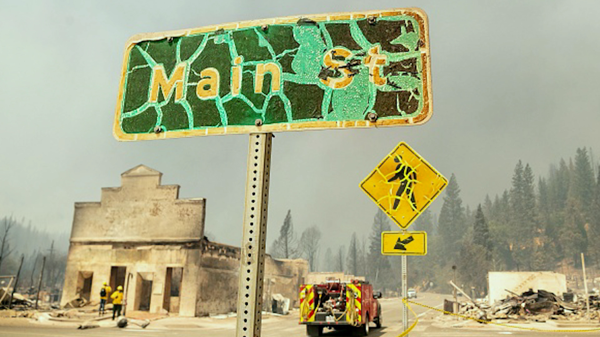 This distorted image shows a rundown mountain community with a firefighting crew present.